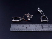 Silver earrings with zircons