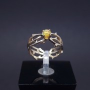 Gold ring with colored stone