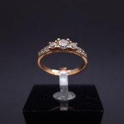 Gold ring with zircons