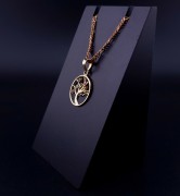 Gold pendant with colored stones