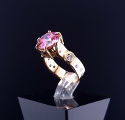 Gold ring with diamonds and moissanite