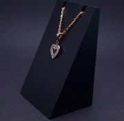 Gold pendant with zircons