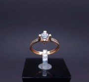 Gold ring with zircons