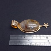 Gold pendant with colored stone