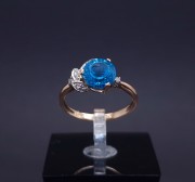 Gold ring with diamonds and colored stone