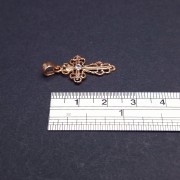 Gold cross with zircon