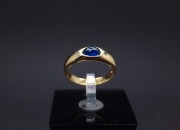 Gold ring with diamonds and colored stone