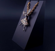 Gold pendant with colored stones