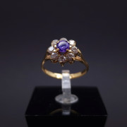 Gold ring with zircons