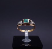 Gold ring with diamonds and colored stone