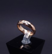 Gold wedding ring with diamonds