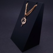 Gold pendant with zircons