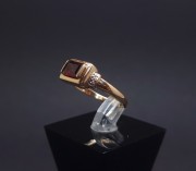 Gold ring with diamonds and colored stone