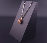 Vintage gold pendant with colored stone