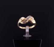 Gold ring with zircons