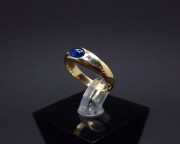 Gold ring with diamonds and colored stone