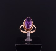 Gold ring with colored stone