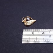 Gold pendant with zircon