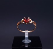 Gold ring with colored stone