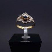 Gold ring with zircons and garnet