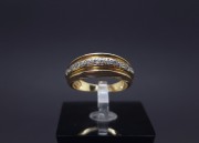 Gold ring with zircons