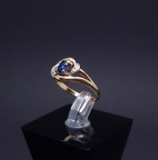 Gold ring with diamonds and colored stone