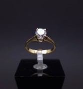 Gold ring with zircon