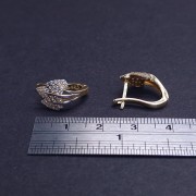 Gold earrings with zircons 