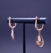 Gold earrings with zircons 