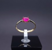 Gold ring with colored stone