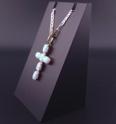 Gold cross with opals