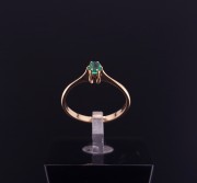 Gold ring with colored stone