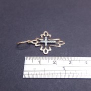 Gold cross with zircons