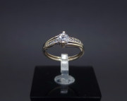 Gold ring with zircons