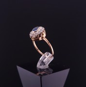 Gold ring with zircons and colored stone