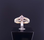 Gold ring with zircons