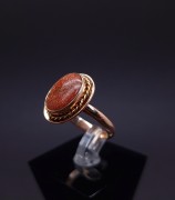 Gold ring with colored stone