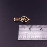 Gold pendant with zircon