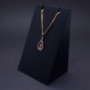 Gold pendant with zircons