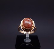 Gold ring with colored stone