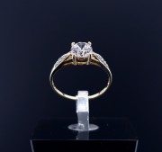 Gold ring with zircons