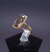 Gold ring with colored stone