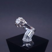 White gold ring with zircons