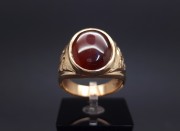 Gold ring with colored stone