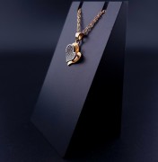Gold pendant with zircons
