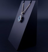 Gold pendant with colored stones