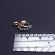 Gold pendant with zircon