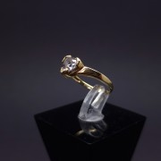 Gold ring in the shape of a heart with zircon