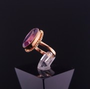 Gold ring with colored stone