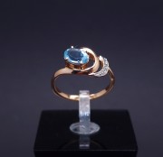 Gold ring with diamonds and colored stone